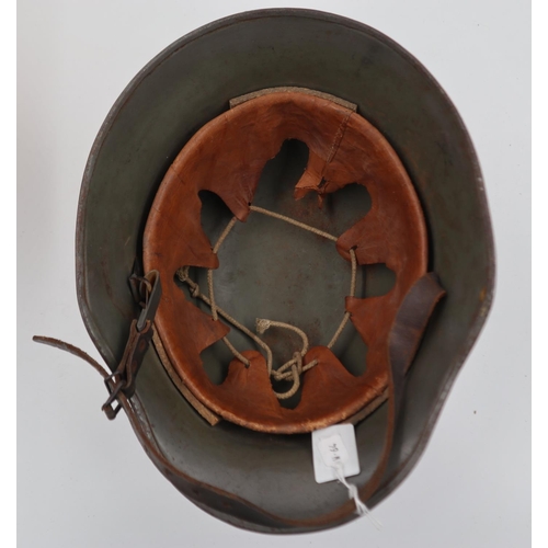 2107 - Excellent example of a WWI Stahlhelm Helmet, with civil liner and chinstrap. This re-used WWI helmet... 