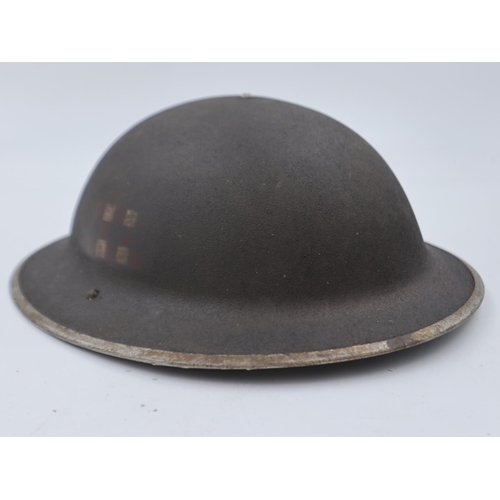 2115 - WWII British Mk II helmet, bearing the insignia of the Scots Guards. This helmet was found in Italy.... 