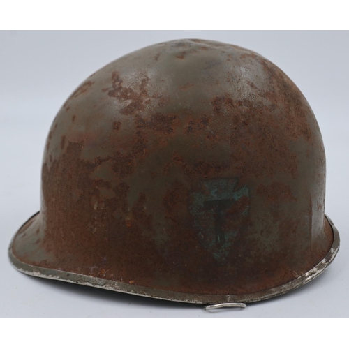 2121 - WWII US McCord front split seam swivel bale M1 helmet, bearing the insignia of the 36th Infantry to ... 