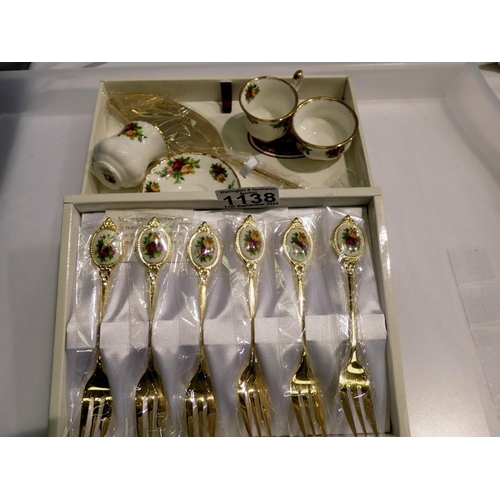 1138 - Royal Albert, brand new in box, gold plated dessert fork and cake slice set, miniature tea cup and s... 