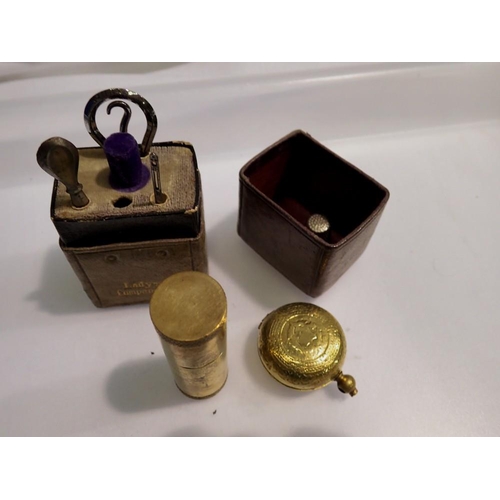 1149 - Brass cigarette lighter, a brass sovereign case and a ladies companion accessories set. UK P&P Group... 