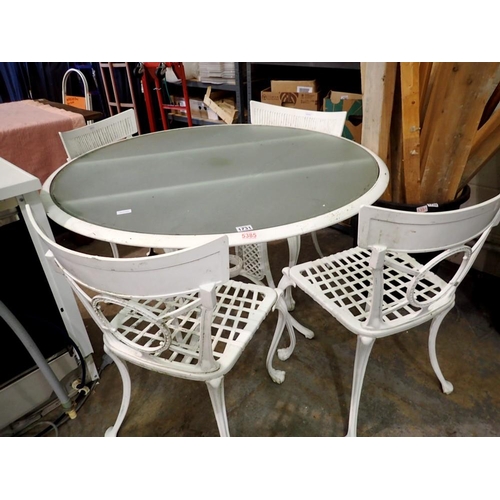 1731 - Circular metal table with glass top and four chairs, D: 120cm. Not available for in-house P&P