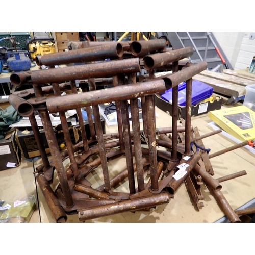 1824 - Set of brown steel roll up ladders. Not available for in-house P&P