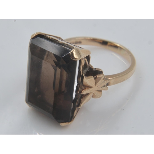 13 - 9ct gold ring set with a large emerald cut amethyst, size Q, 7.6g. UK P&P Group 0 (£6+VAT for the fi... 