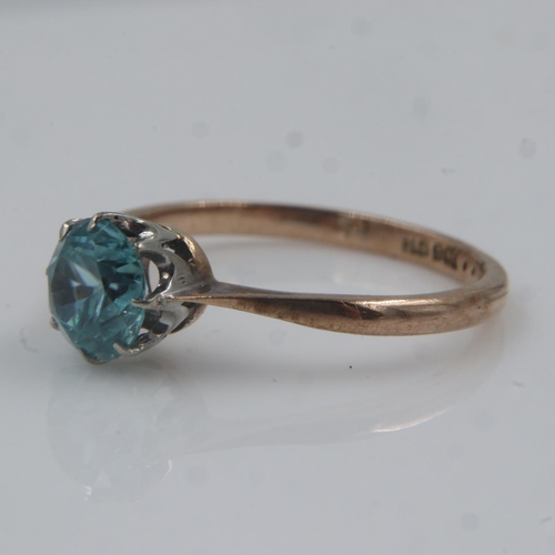 20 - 9ct gold solitaire ring set with blue zircon, size L/M, 1.6g. Shank showing minimal signs of wear, s... 