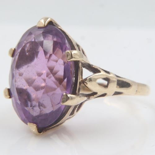 28 - 9ct gold ring set with a large oval cut amethyst, size O, 5.4g. UK P&P Group 0 (£6+VAT for the first... 