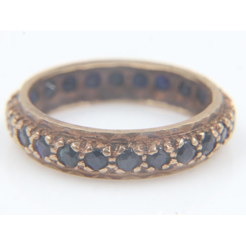 44 - 9ct gold and coloured cubic zirconia eternity ring, size O, 2.4g. UK P&P Group 0 (£6+VAT for the fir... 