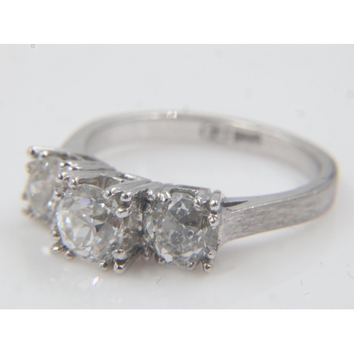 47 - 14ct white gold diamond-set trilogy ring, old-cut stones totalling 1.64cts, size M, 4.5g. Scar acros... 