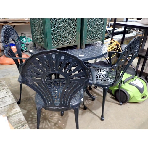 1767A - Green cast iron garden table with four matching cast iron chairs. Not available for in-house P&P