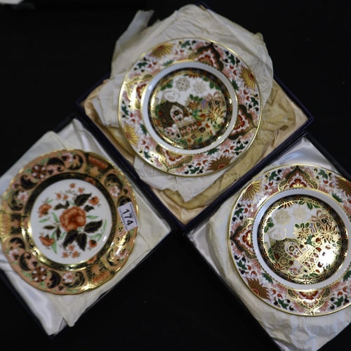 174 - Royal Crown Derby boxed cabinet plates, Derby Pink Camellias, and two limited edition Christmas plat... 