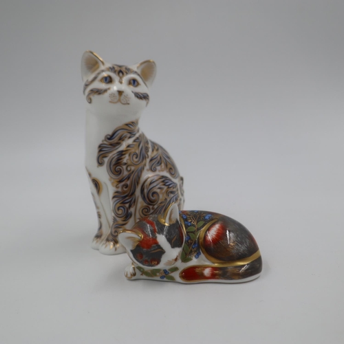 195 - Royal Crown Derby seated cat paperweight and a lying cat, both with gold stoppers, largest H: 13 cm.... 