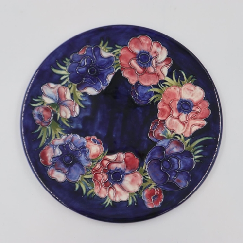 232 - Moorcroft charger in the Anemone pattern on a cobalt blue ground, original paper label to base, D: 3... 