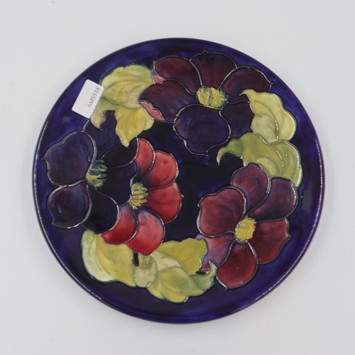 240 - Moorcroft charger in the Clematis pattern on a cobalt blue ground, original paper label to base, D: ... 