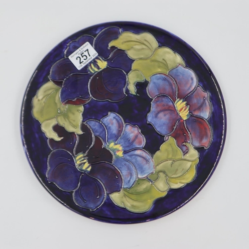 257 - Moorcroft charger in the Clematis pattern on cobalt blue ground, original paper label to base, D: 31... 