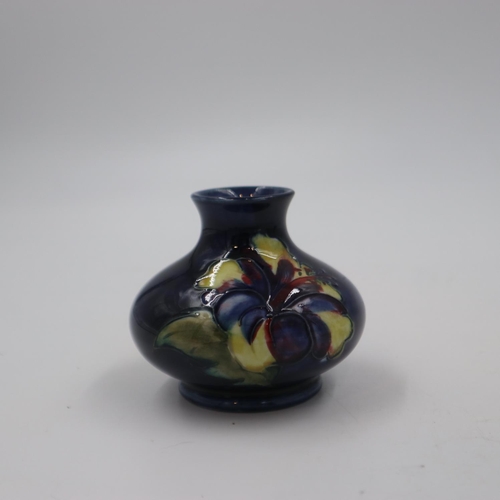 270 - Moorcroft squat vase om the Hibiscus pattern on a cobalt blue ground, original paper label to base, ... 