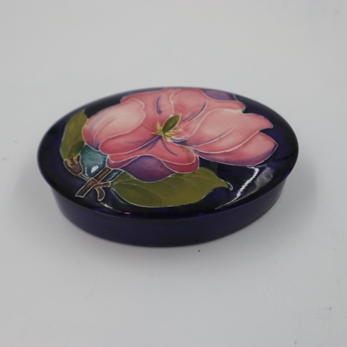 274 - Moorcroft oval lidded trinket box in the Pink Magnolia pattern, no cracks or chips, L: 13 cm. UK P&P... 