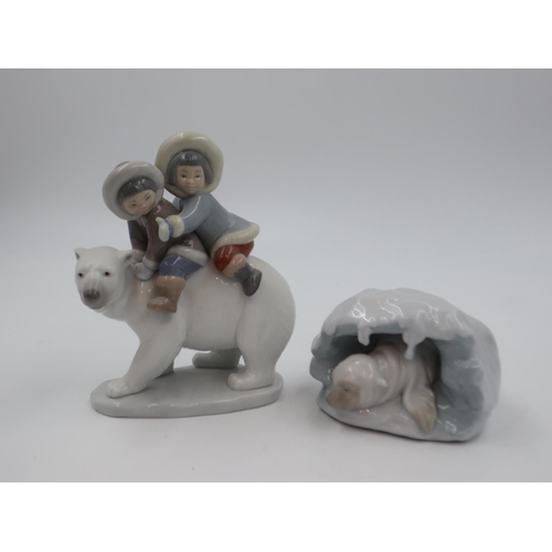 286 - Two Lladro figures, Eskimo Riders and A Snowy Haven, both boxed, largest H: 17.5cm. UK P&P Group 3 (... 