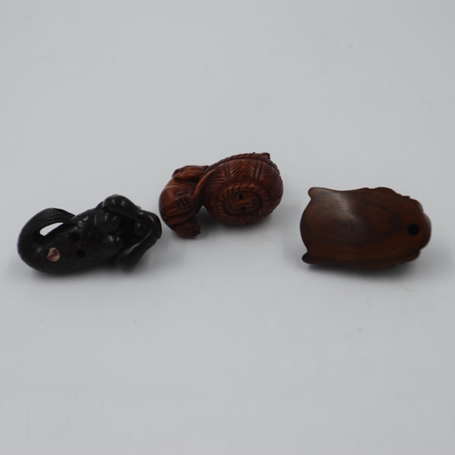 312 - Three Japanese carved wood netsukes, two signed, one to panel. UK P&P Group 1 (£16+VAT for the first... 