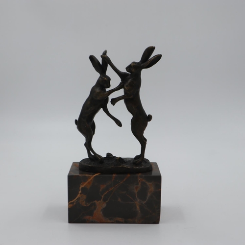 315 - Bronze fighting hares on marble base, overall H: 25 cm, figures and base are in good order with no i... 