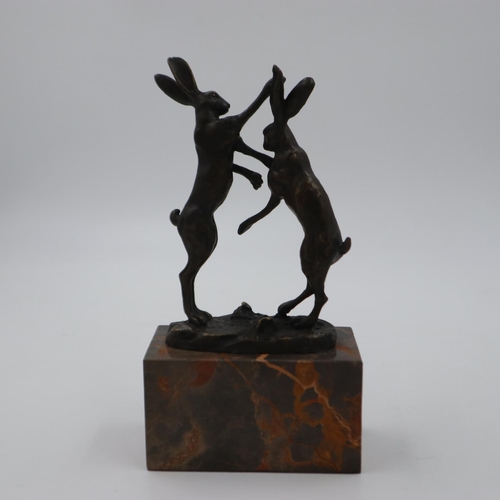 315 - Bronze fighting hares on marble base, overall H: 25 cm, figures and base are in good order with no i... 