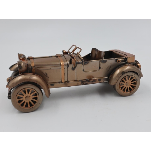 317 - Tin plate racing car, L: 23 cm. UK P&P Group 2 (£20+VAT for the first lot and £4+VAT for subsequent ... 