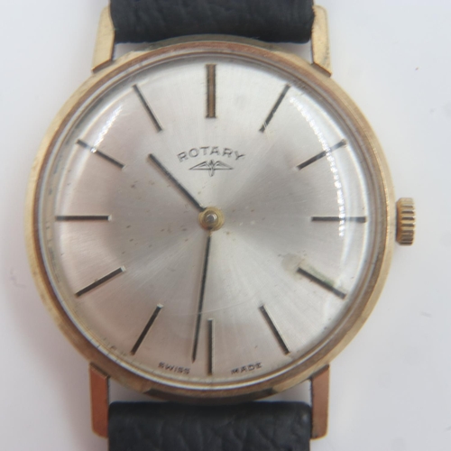 89 - ROTARY: gents 9ct gold cased manual wind wristwatch, silvered dial with baton chapters, on a black l... 