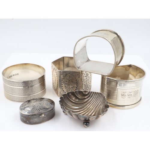 138 - Collection of sterling silver items to include four napkin rings, a patch box and open salt, combine... 