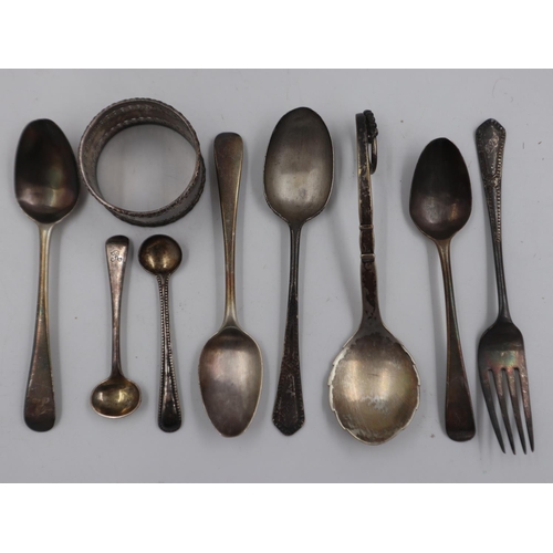 145 - Collection of sterling silver items, including a napkin ring and cutlery, combined weight 129g, also... 