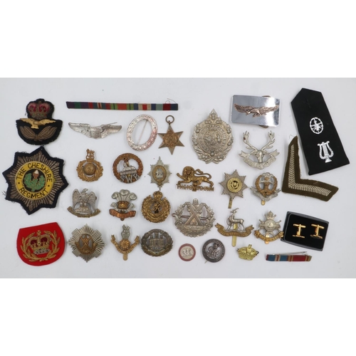 2215 - A collection of 20th century British regimetal cap badges, including Scottish examples, WWII star an... 