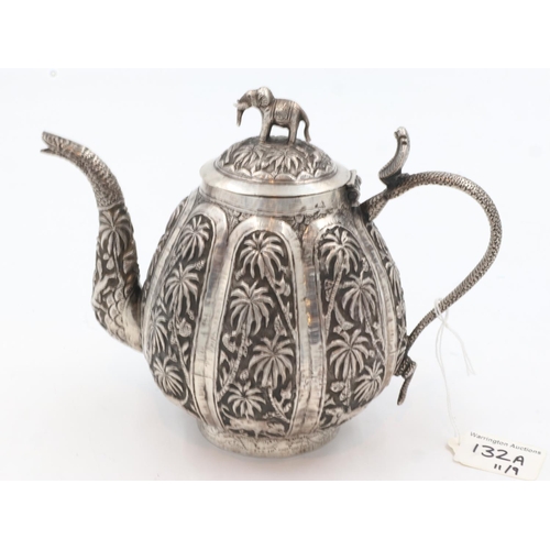 132A - 19th century Raj period Indian silver teapot, the body having designs of palm trees and indigenous a... 