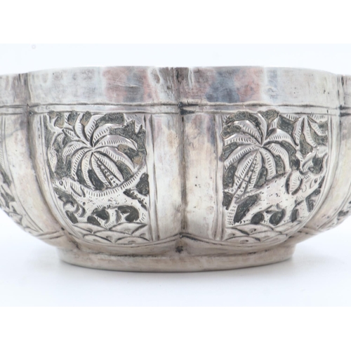 132B - 19th century Raj period Indian silver bowl, the body having designs of palm trees and indigenous ani... 