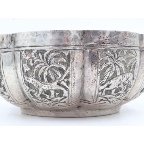 132B - 19th century Raj period Indian silver bowl, the body having designs of palm trees and indigenous ani... 