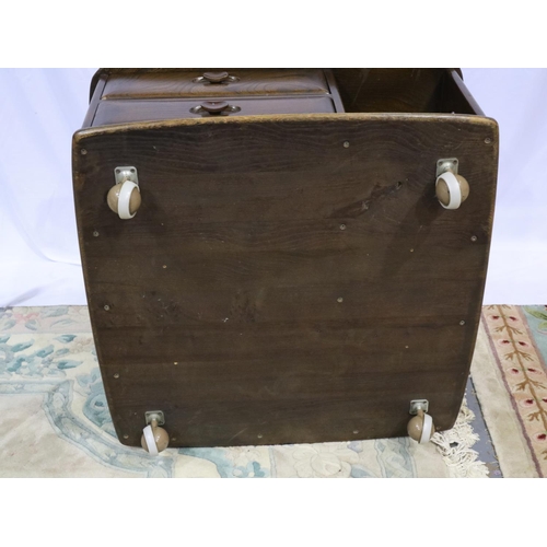 2110 - Ercol dark elm Pandoras Box square form centre table with two drawers and shelves, raised on shepher... 