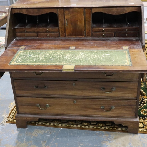 2129 - A substantial Georgian mahogany bureau, with hinged fall-front, the interior fitted with drawers, pi... 