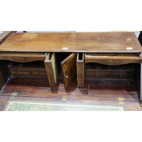 2129 - A substantial Georgian mahogany bureau, with hinged fall-front, the interior fitted with drawers, pi... 