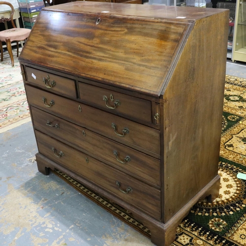 2129 - A substantial Georgian mahogany bureau, with hinged fall-front, the interior fitted with drawers, pi... 