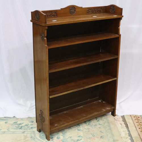 2137 - Art Nouveau period walnut bookcase having three adjustable shelves and carved frame, 91 x 26 x 123 c... 