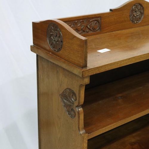 2137 - Art Nouveau period walnut bookcase having three adjustable shelves and carved frame, 91 x 26 x 123 c... 