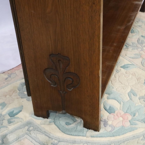 2137 - Art Nouveau period walnut bookcase having three adjustable shelves and carved frame, 91 x 26 x 123 c... 