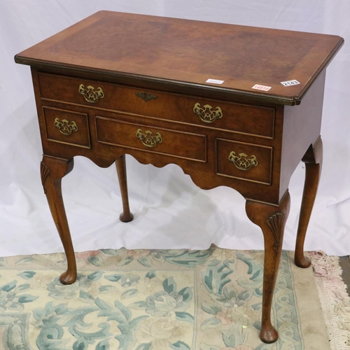 2143 - 20th century reproduction feather-banded walnut lowboy of four drawers, 76 x 45 x 76 cm H. Not avail... 