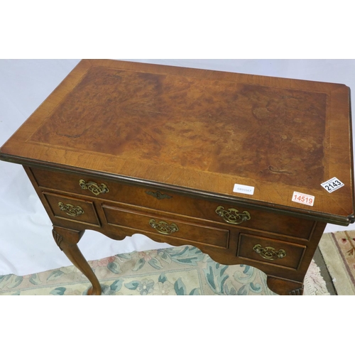 2143 - 20th century reproduction feather-banded walnut lowboy of four drawers, 76 x 45 x 76 cm H. Not avail... 