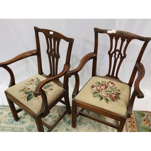 2146 - A pair of early 19th century mahogany elbow chairs, in the Chippendale style, with carved backrest a... 