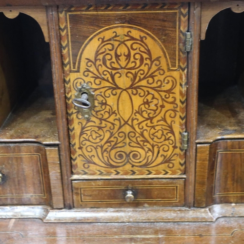 2147 - *KEYS IN OFFICE* An early 18th century walnut bureau, with stepped fitted interior, two short above ... 