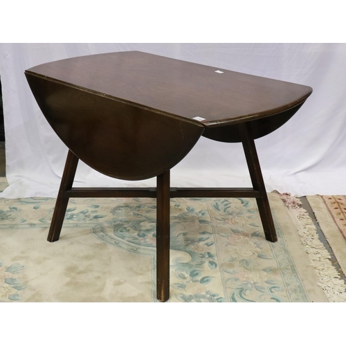 2148 - Ercol dark elm dining suite comprising circular drop leaf table and four chairs, one chair with dama... 