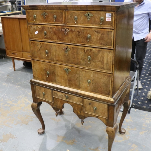 2152 - An early 18th century banded walnut chest-on-stand, having two-short and three graduating long drawe... 