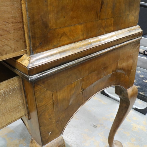 2152 - An early 18th century banded walnut chest-on-stand, having two-short and three graduating long drawe... 