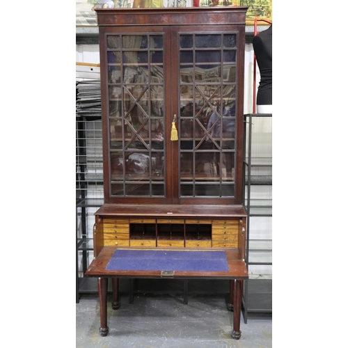 2160 - A monumental 19th century secretaire, the single fitted drawer sits on four turned supports and bene... 