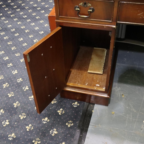 2161 - A reproduction mahogany twin-pedestal desk, with leather inset top, each pedestal with cupboards sui... 