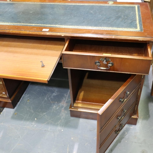 2161 - A reproduction mahogany twin-pedestal desk, with leather inset top, each pedestal with cupboards sui... 