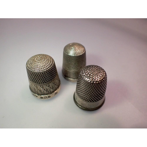 1052 - Hallmarked silver thimble, a Hovis thimble and another. UK P&P Group 1 (£16+VAT for the first lot an... 